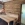 Verkleidung einer Küchenecke mit Altholzschalung, dazu passend eine Eckbank mit Esstisch in Esche astig, geölt