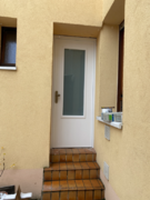 Hoftür in glatter Bauweise, weiß lasiert